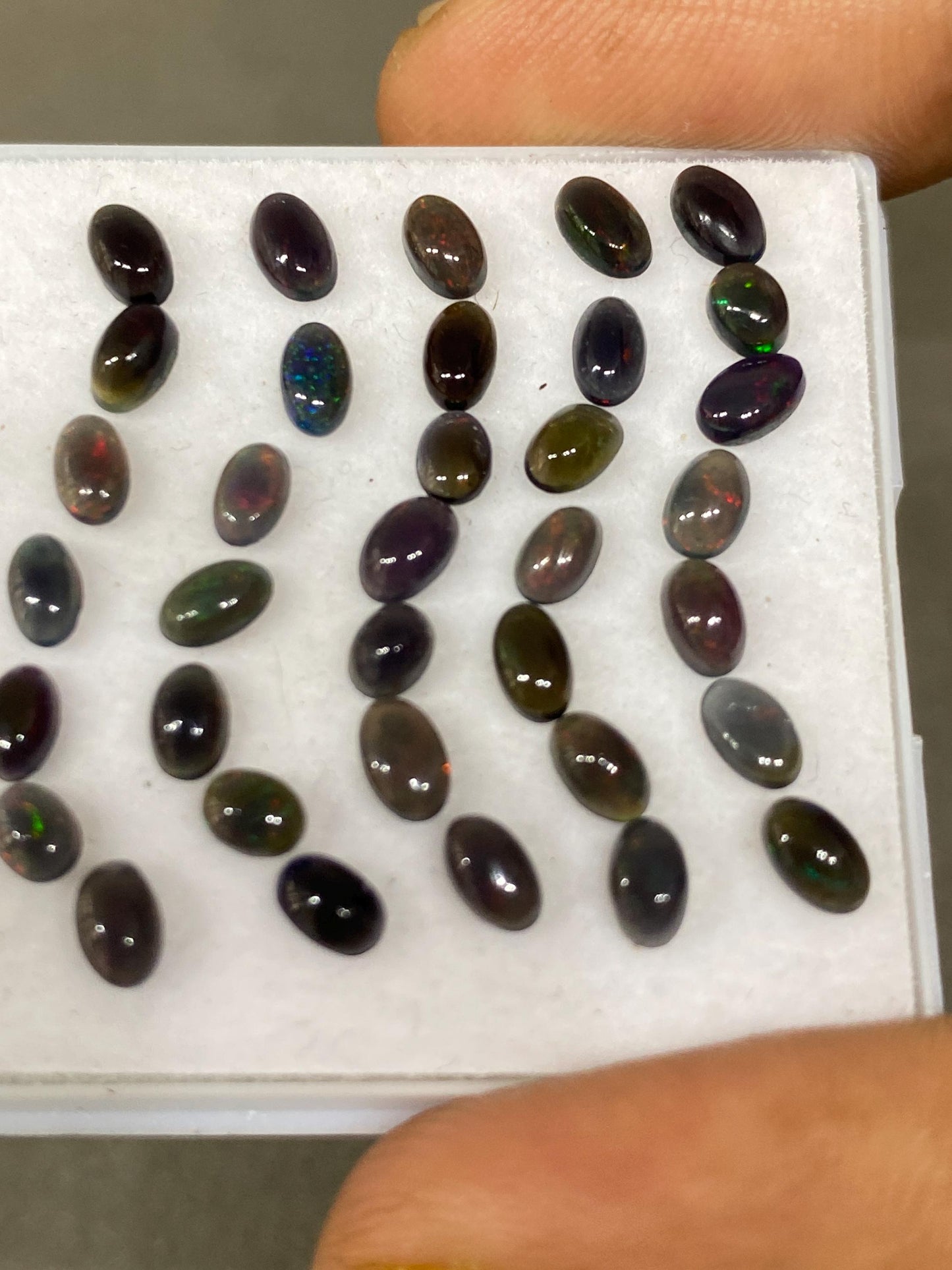 Black Natural opal (smoked) Ethiopian mines Natural opal cabochons lot size 5x3mm wt 5.75 carats pcs 35 black opal cabochons (torch light)