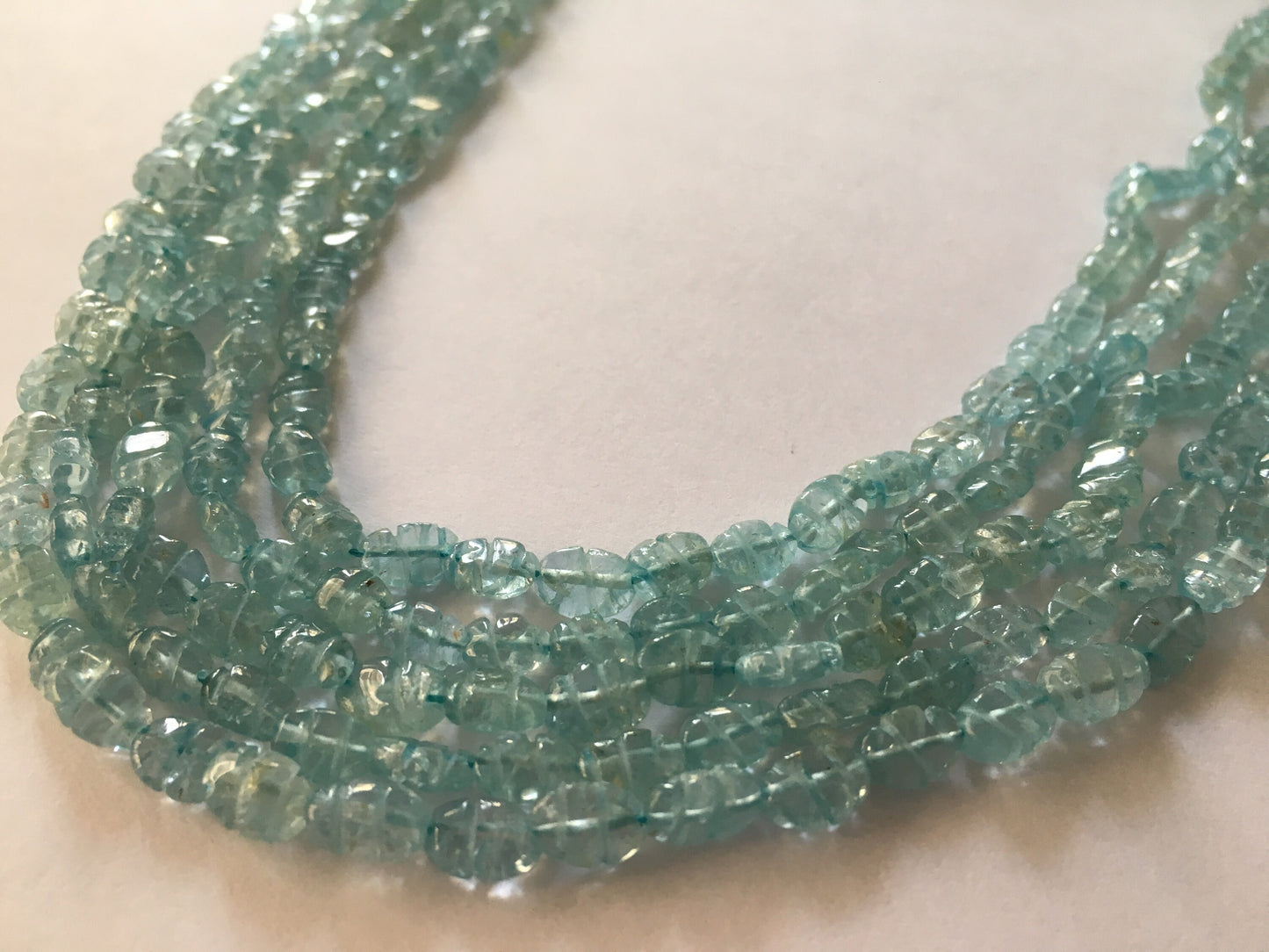 Aquamarine carving strands beautiful aquamarine carving beads size 7x5mm weight 215 carats length 14 inches carved aquamarine strands