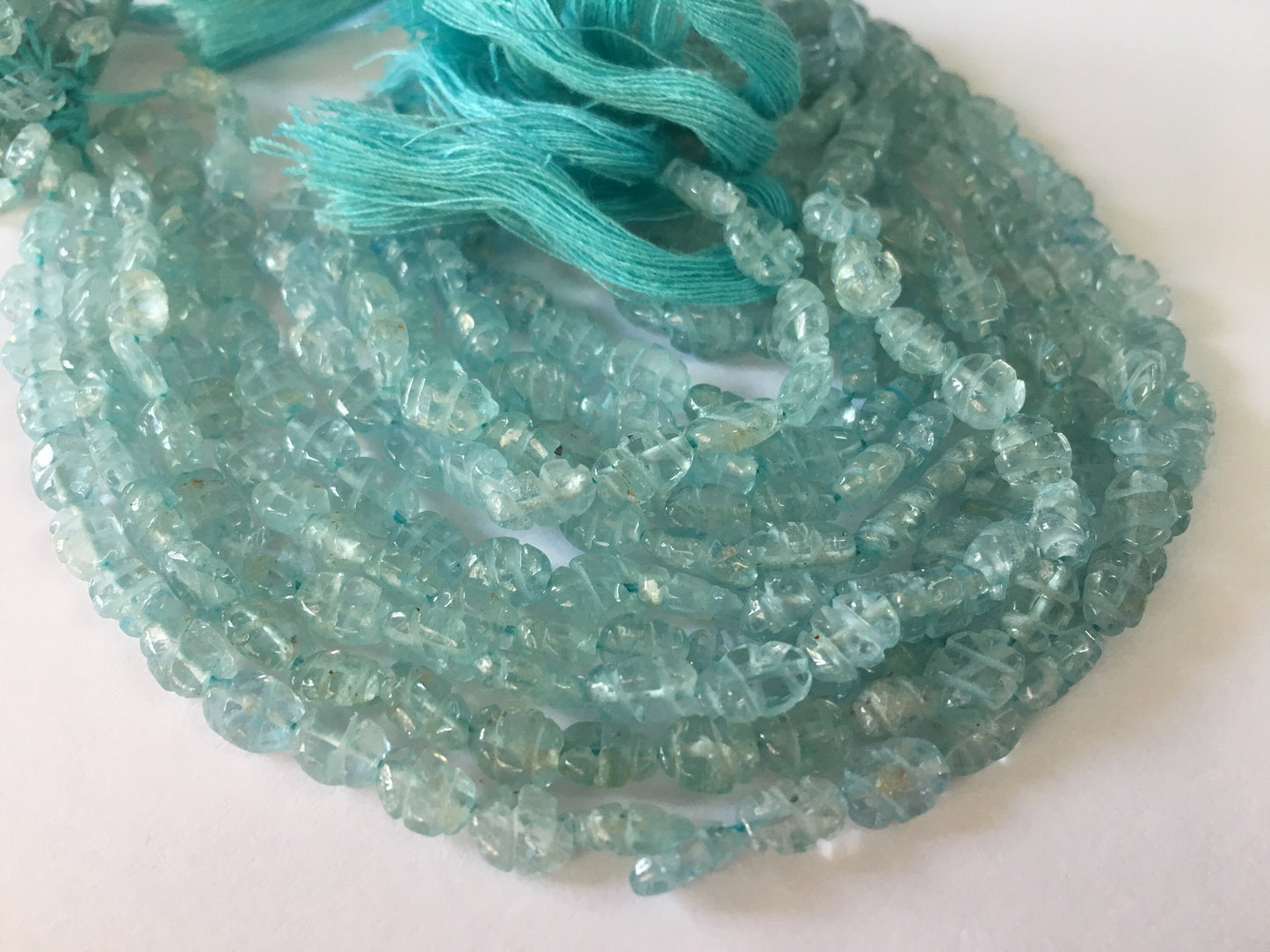 Aquamarine carving strands beautiful aquamarine carving beads size 7x5mm weight 215 carats length 14 inches carved aquamarine strands