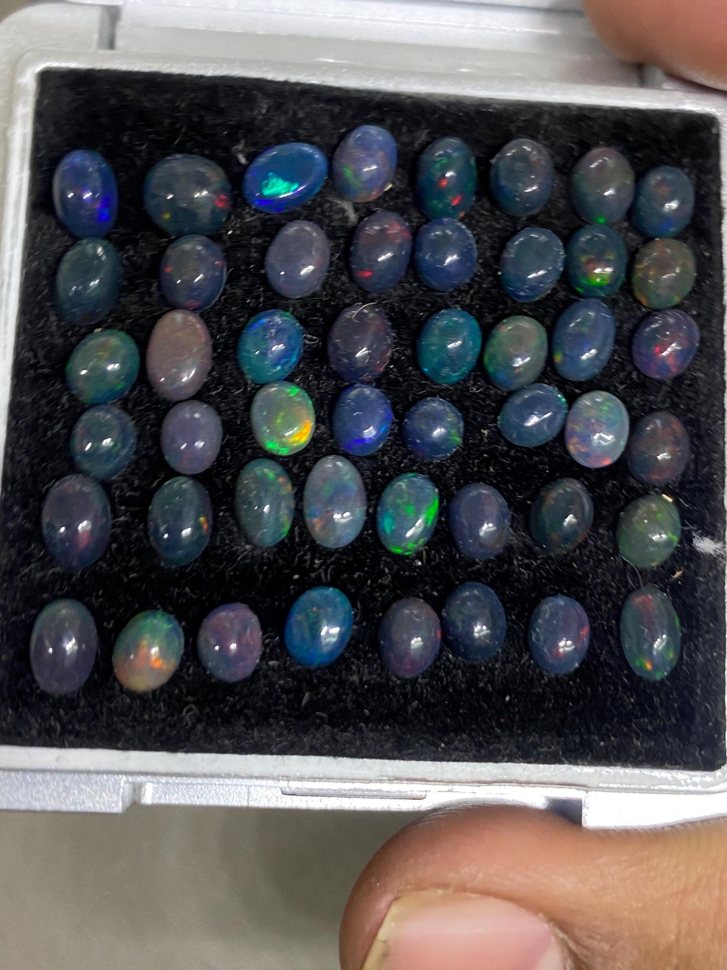 Dazzling Black Natural opal (smoked) Ethiopian mines opal cabochons lot size 4mm-5mm wt 11.85 cts pcs 48 black opal cabochons (torch light)