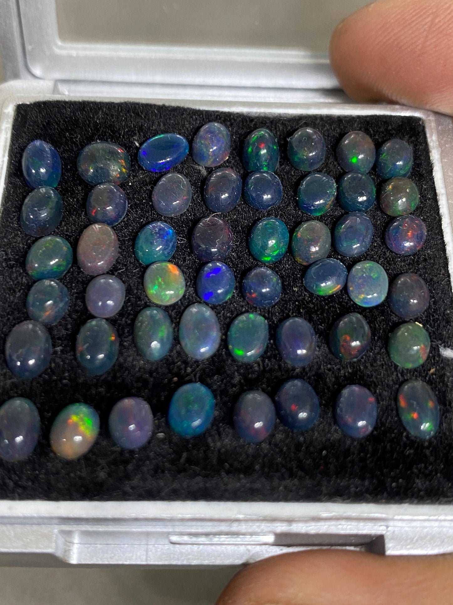 Dazzling Black Natural opal (smoked) Ethiopian mines opal cabochons lot size 4mm-5mm wt 11.85 cts pcs 48 black opal cabochons (torch light)