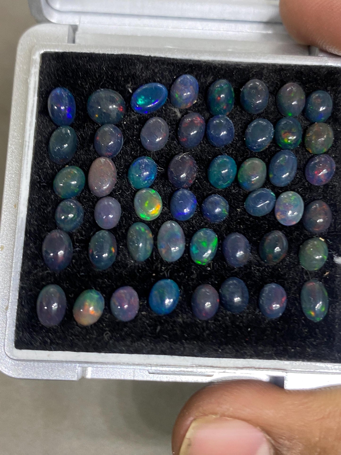 Dazzling Black Natural opal (smoked) Ethiopian mines opal cabochons lot size 4mm-5mm wt 11.85 cts pcs 48 black opal cabochons (torch light)