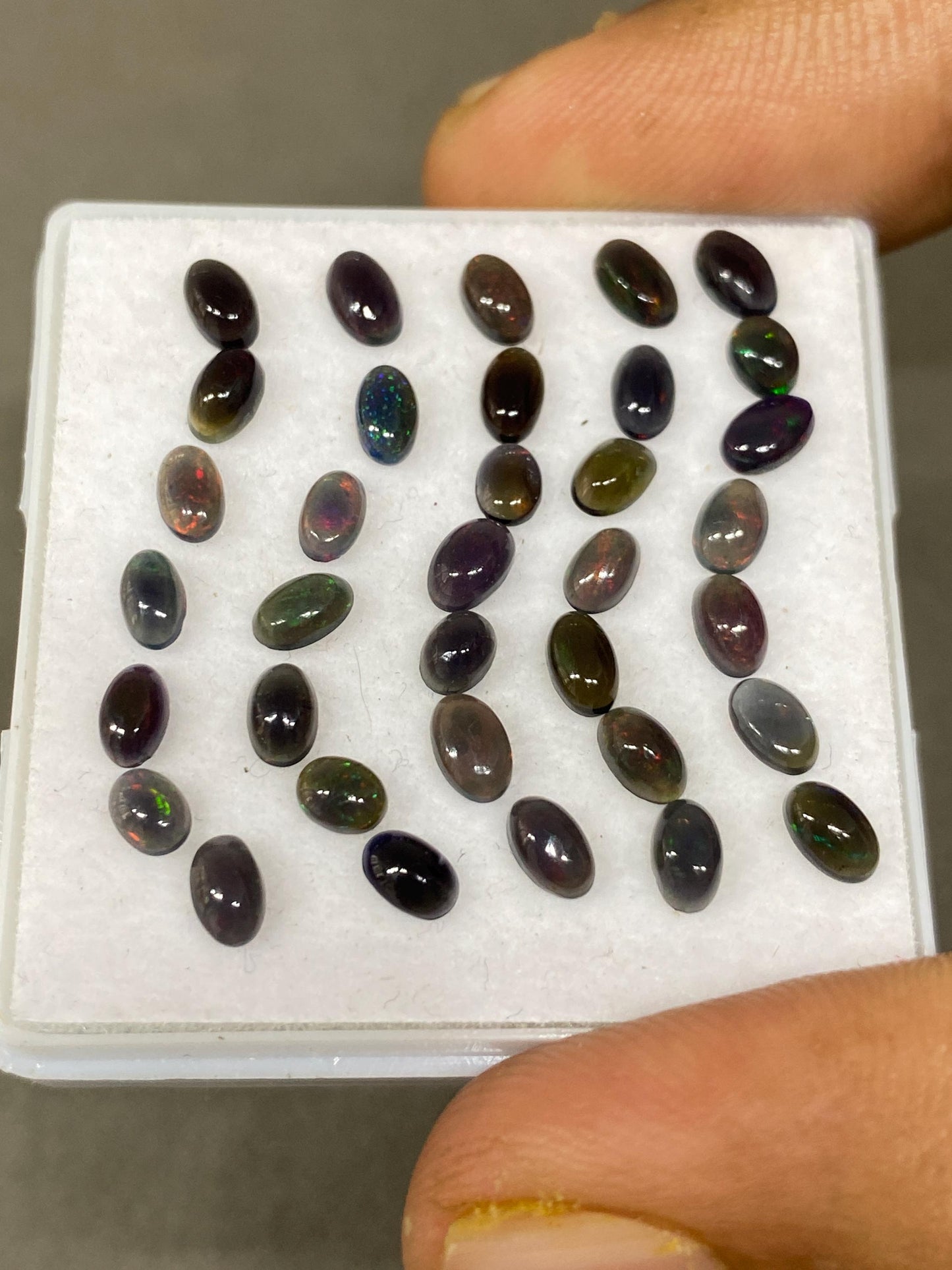 Black Natural opal (smoked) Ethiopian mines Natural opal cabochons lot size 5x3mm wt 5.75 carats pcs 35 black opal cabochons (torch light)