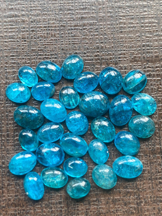 Neon blue apatite flat cabochons oval rounds wholesale lot pcs 30 weight 16.15 carats size 5x3.7mm-6.7x5.6mm electric blue apatite cabochons