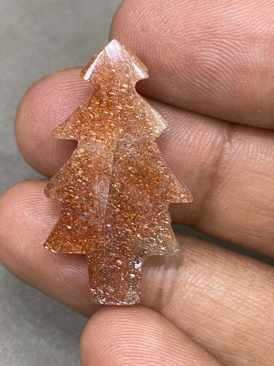 Stunning Confetti Sunstone christmas tree shape carving  pcs 1 wt 19.10 cts size 35x18mm Sunstone Christmas tree carving