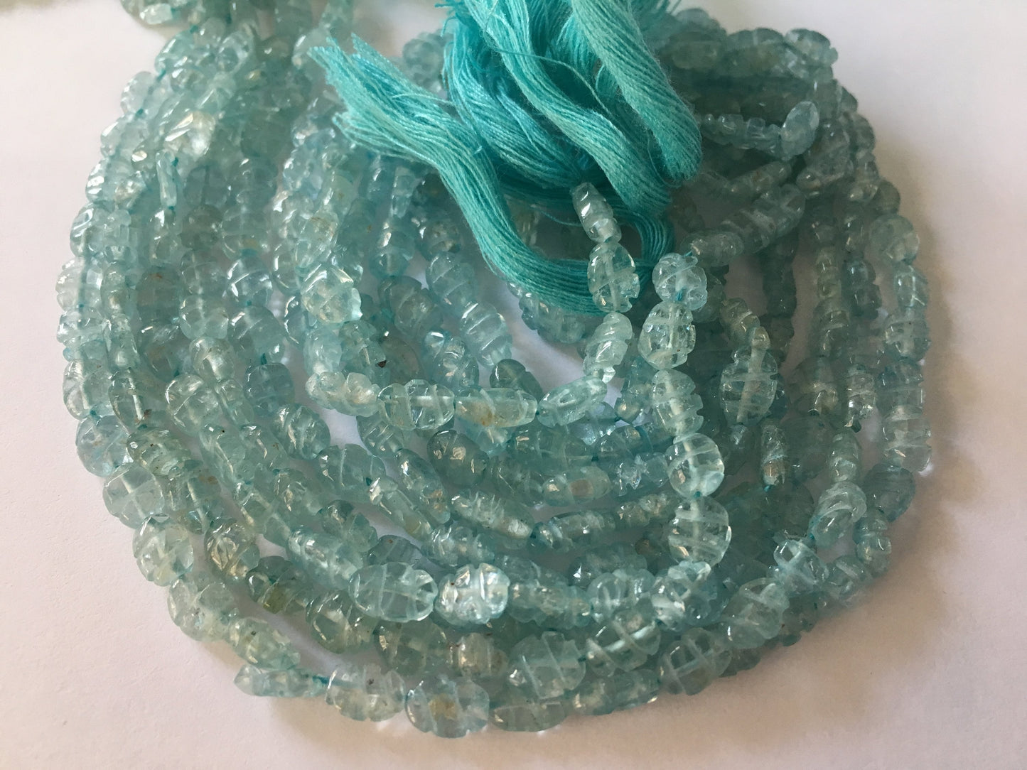 Aquamarine carving strands beautiful aquamarine carving beads size 7x5mm weight 215 carats length 14 inches carved aquamarine strands