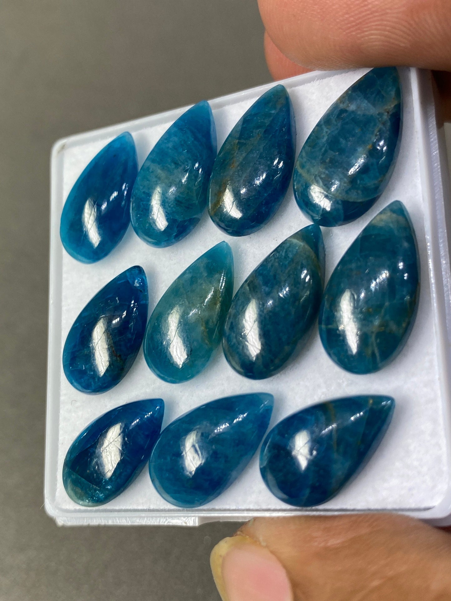 Neon blue apatite flat cabochons pears wholesale lot pcs 11 weight 60 carats size 16x9mm-19x10mm blue apatite cabochons