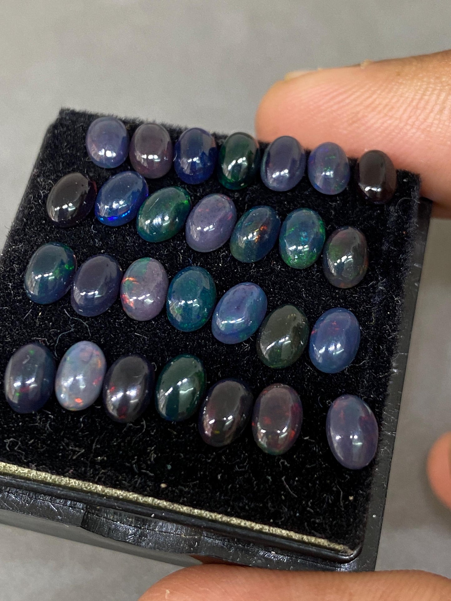 Vivacious Black Natural opal (smoked) Ethiopian mines opal cabochons lot size 6x4mm wt 9.20 cts pcs 28 black opal cabochons (torch light)