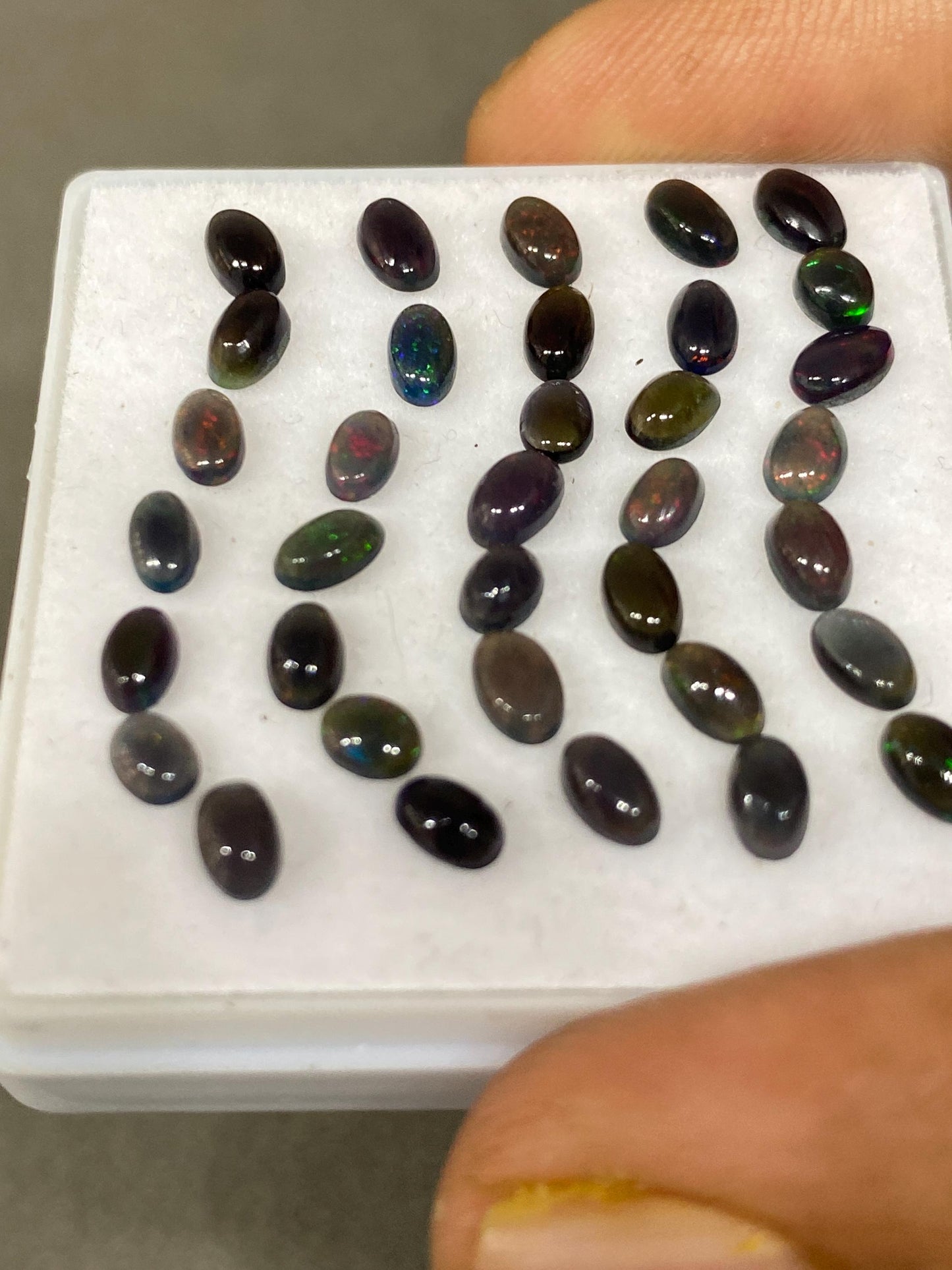 Black Natural opal (smoked) Ethiopian mines Natural opal cabochons lot size 5x3mm wt 5.75 carats pcs 35 black opal cabochons (torch light)