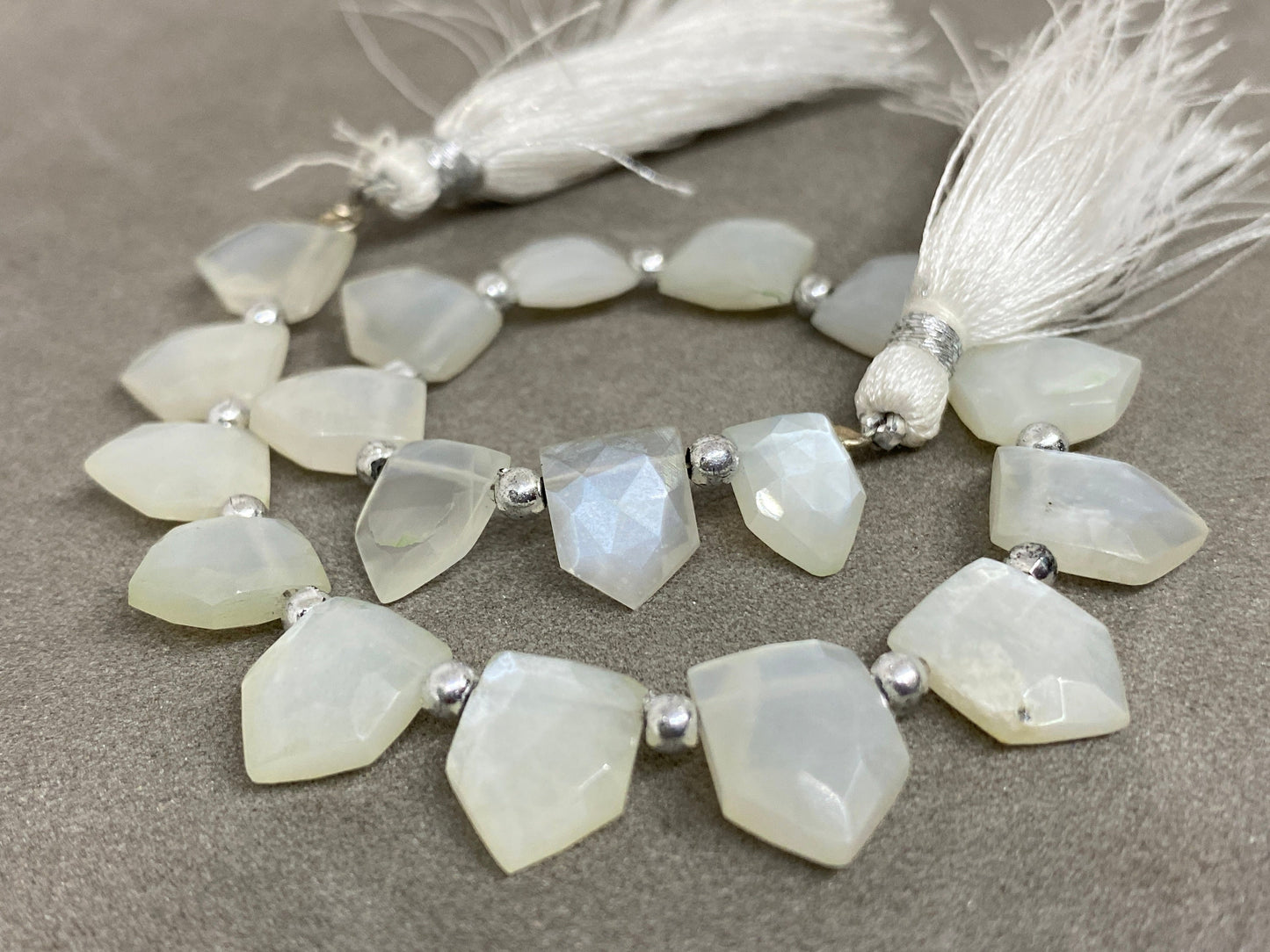 Wow white moonstone faceted pentagon hut briolette 8 inches wt 54 cts  pcs 18 size 9x7mm-12x9mm faceted moonstone hut briolette